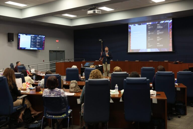 Jonathan Swindle presents to a crowd of educators on AI